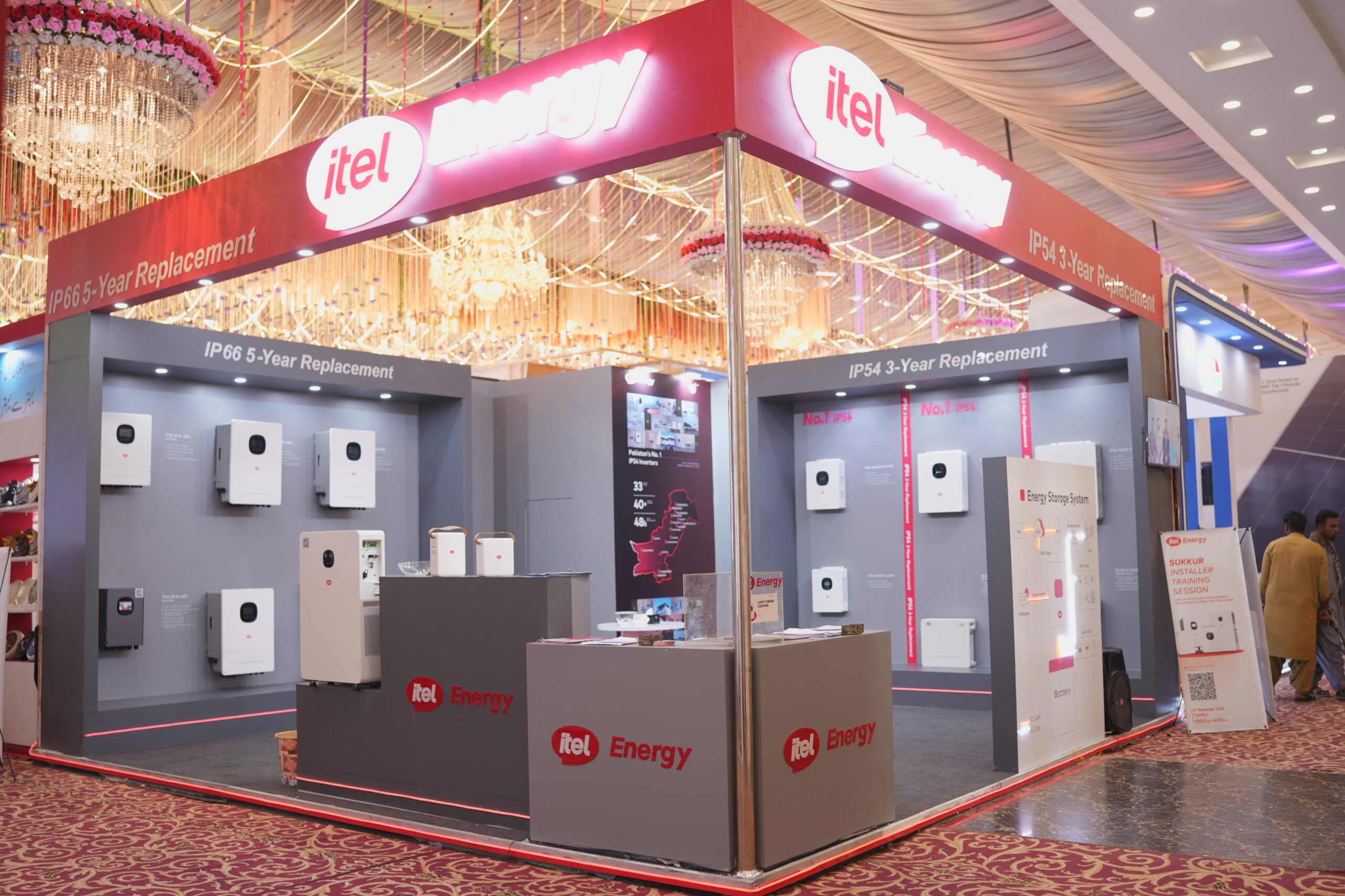 itel Energy custom solar exhibition booth with illuminated red fascia and product displays